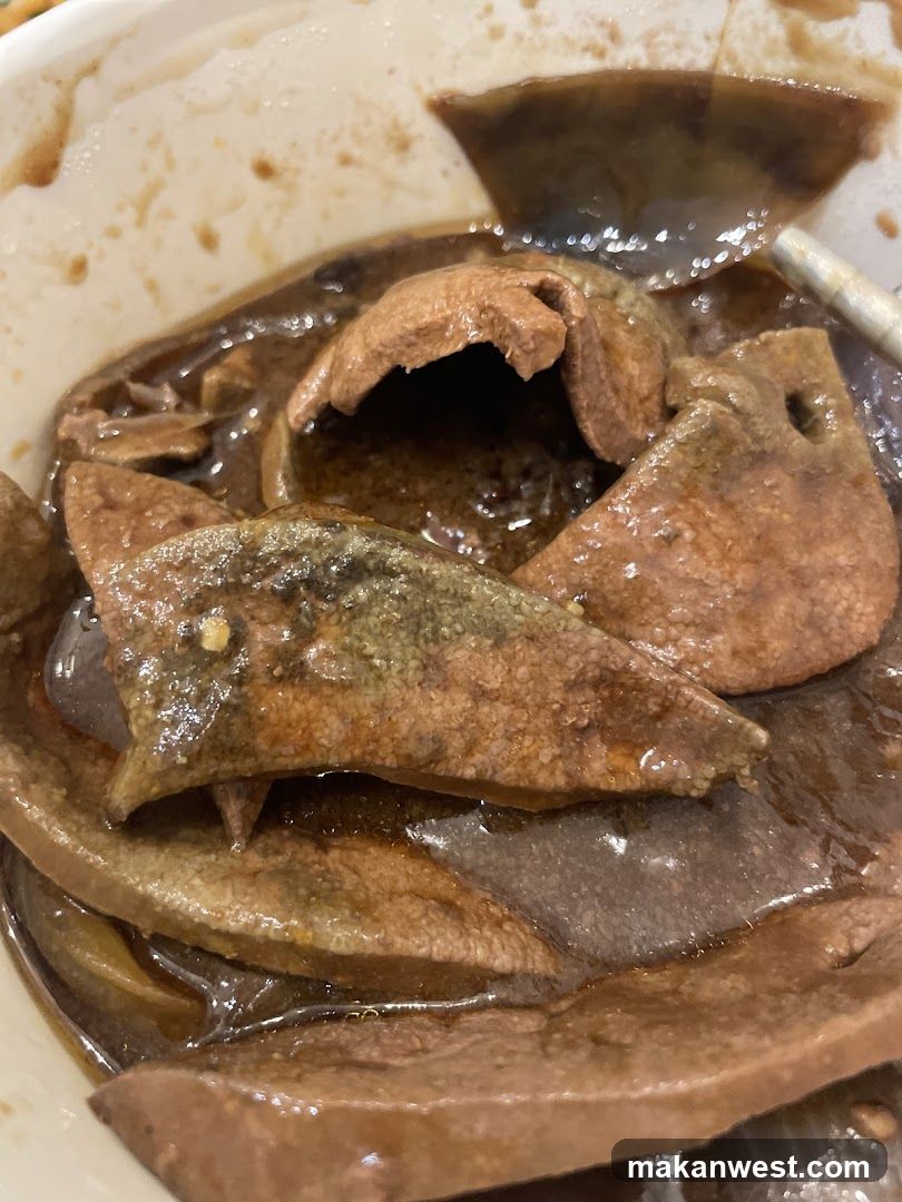 Bowl of cooked offal in broth