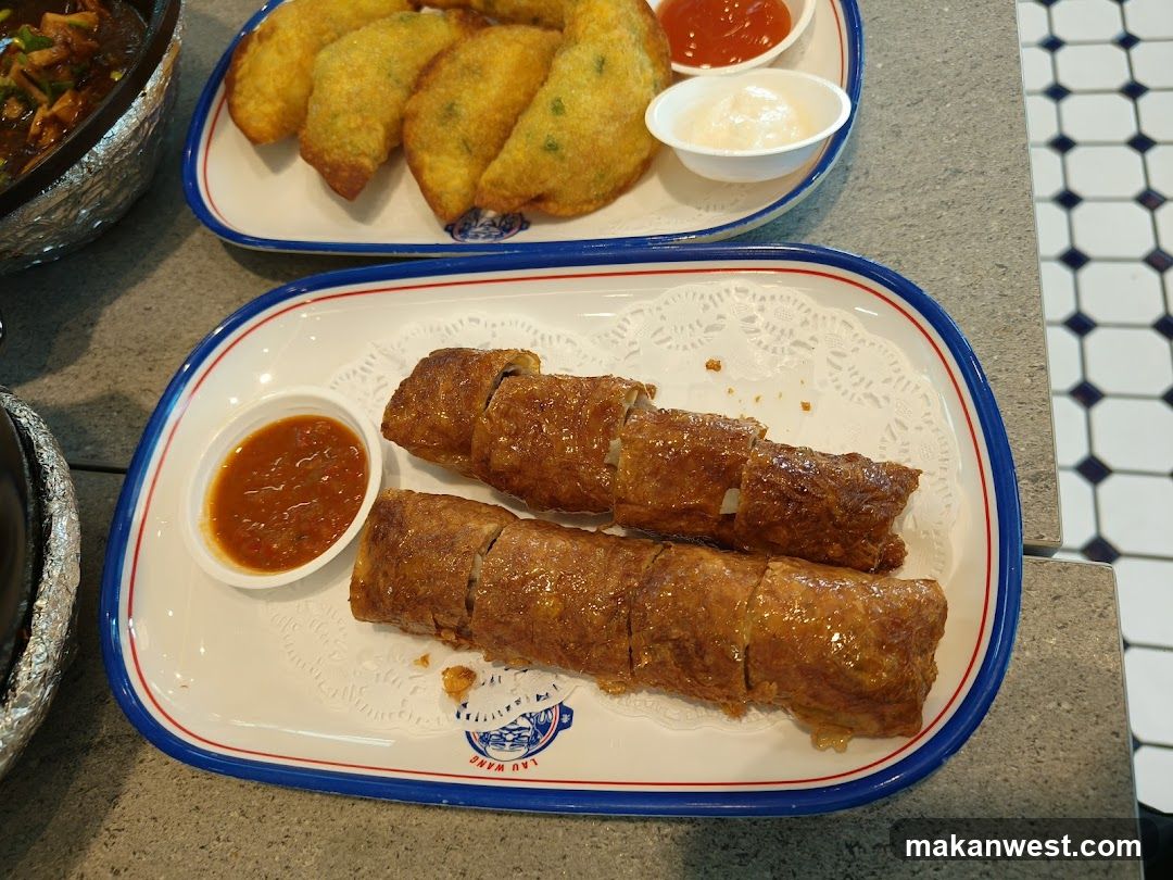 Food Platter with Spring Rolls and Fried Dishes