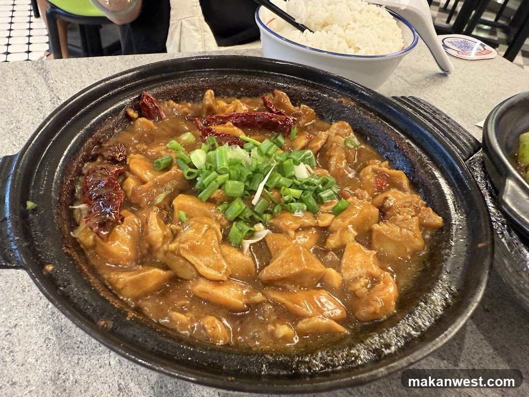 Sizzling Chicken Dish in Clay Pot