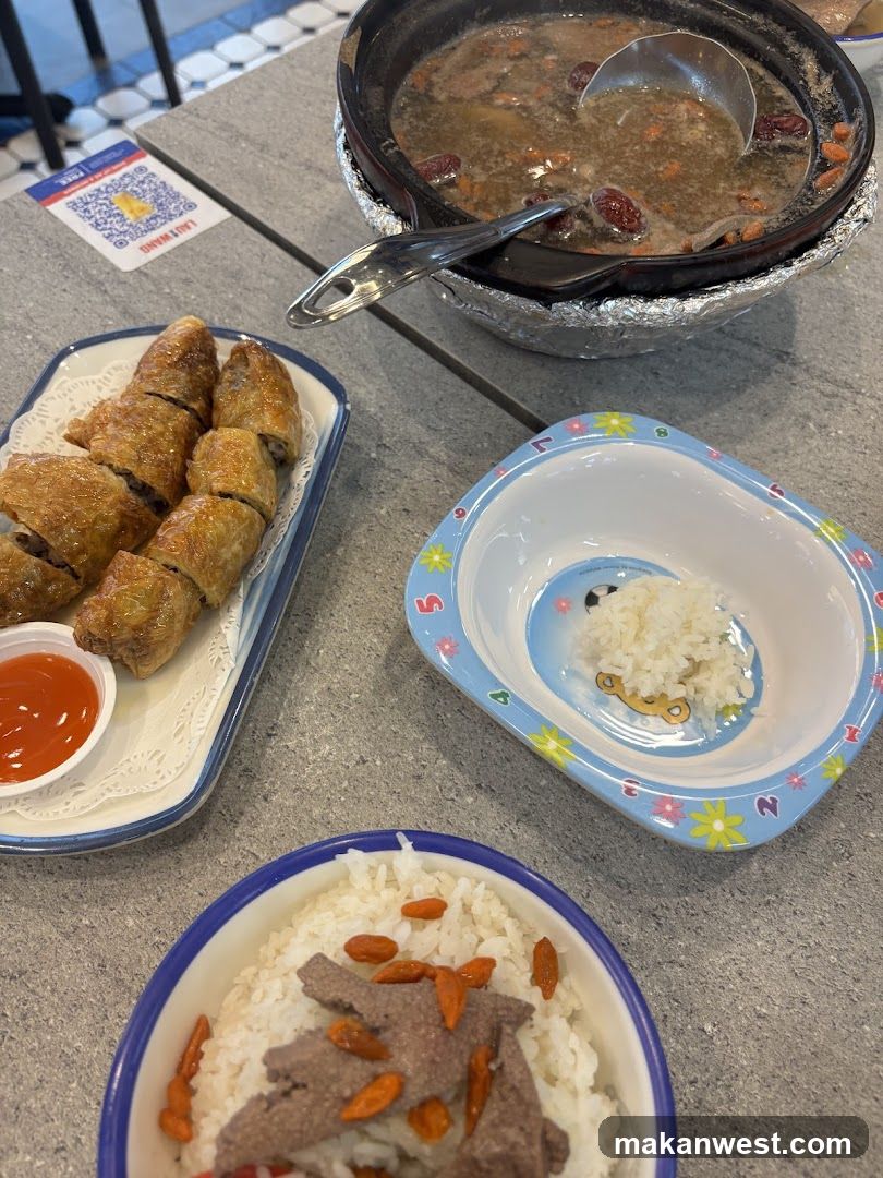 Food Spread with Soup and Rolls