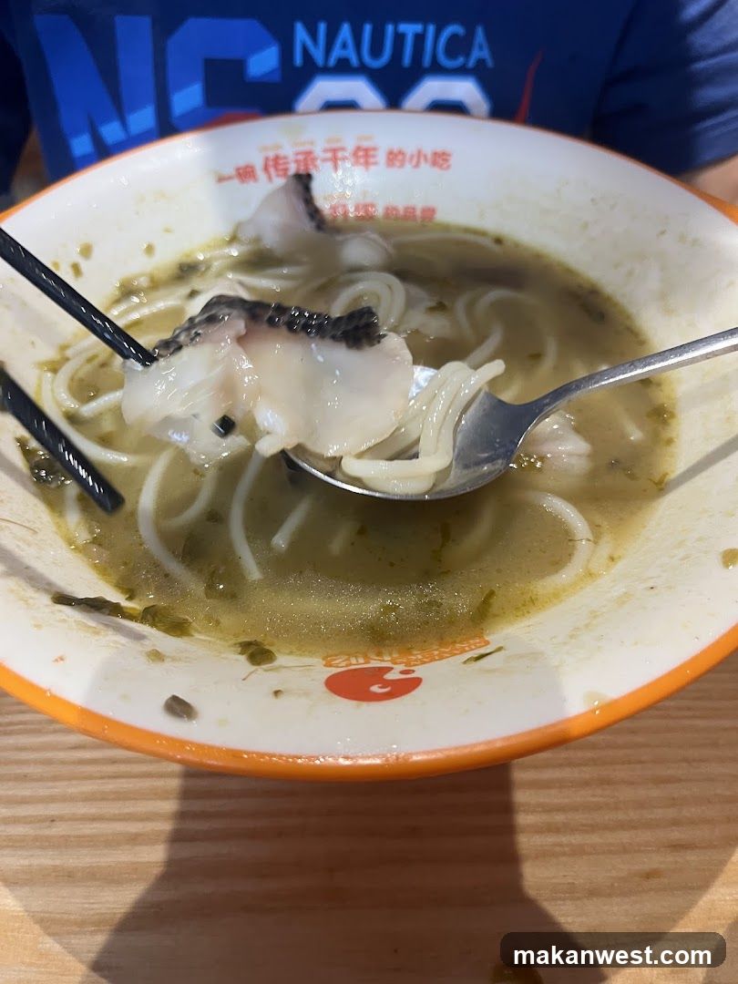 Bowl of noodle soup with fish
