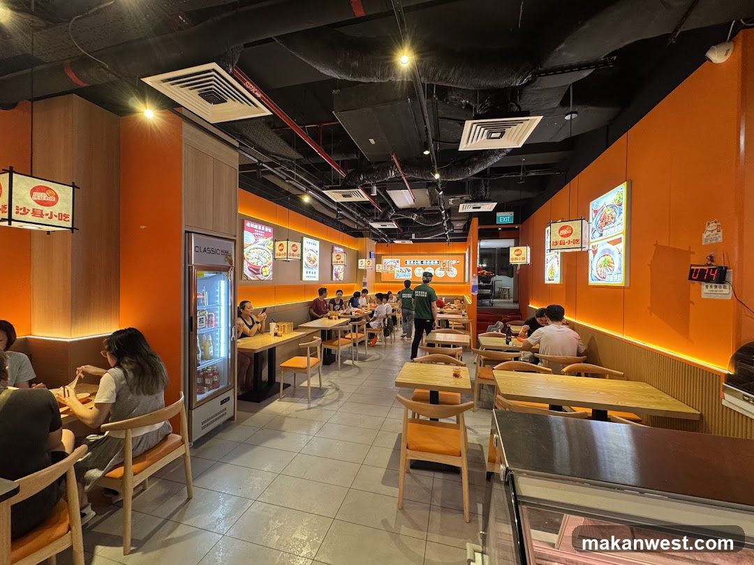 Restaurant Interior with Orange Walls and Wooden Tables