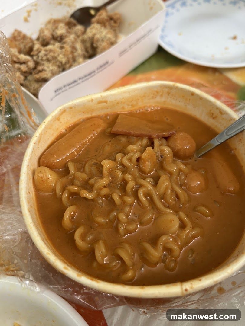 Bowl of Instant Noodles with Curry Sauce and Sausage