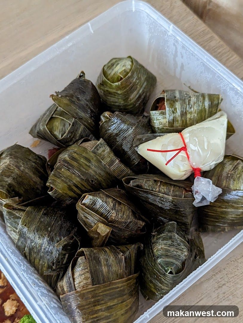Bamboo-wrapped food items in container