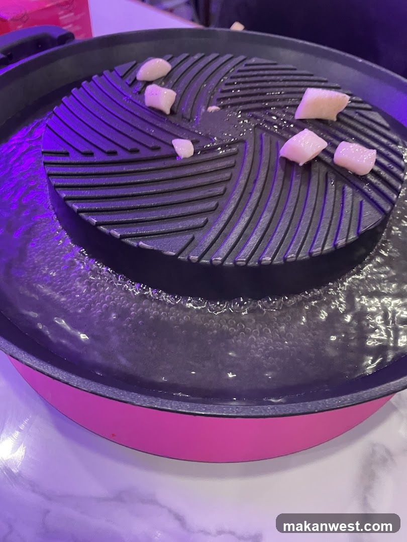Grill with Boiling Water and Slices of Fish