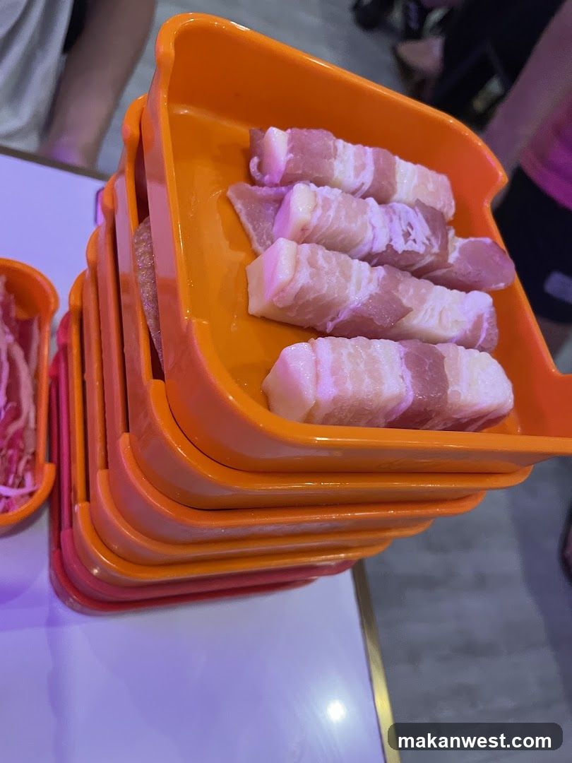 Raw Meat Slices in Orange Containers