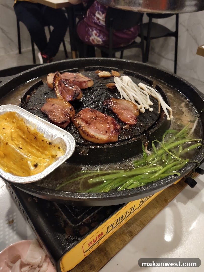 Grilled Meat and Vegetables on a Hot Plate