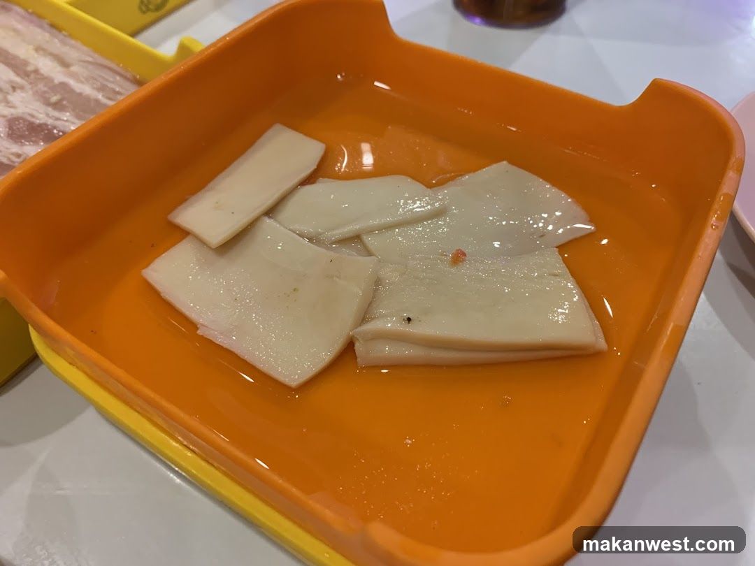 Orange tray with sliced food items