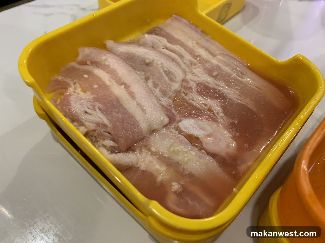 Raw Pork Slices in Yellow Container