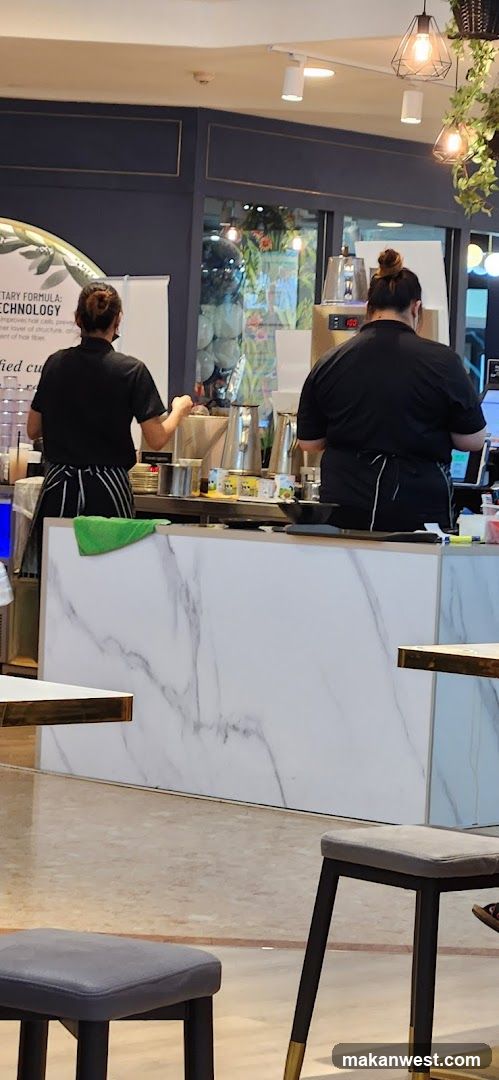Coffee Shop Interior with Staff Preparing Drinks