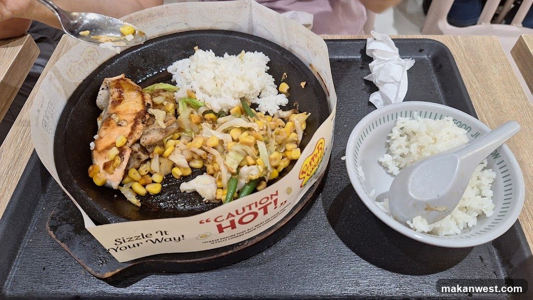 Sizzling Dish with Rice and Bowl of Rice