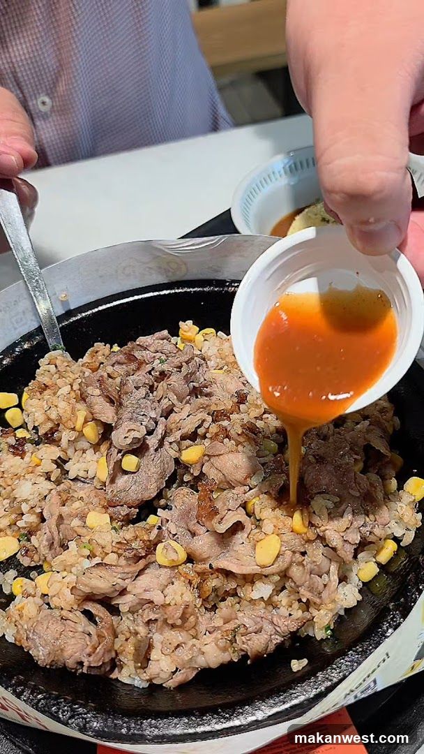 Sizzling Rice Bowl with Sauce Pouring