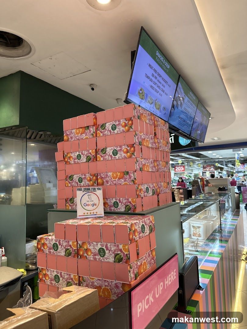 Stack of Pink Boxes with Oranges