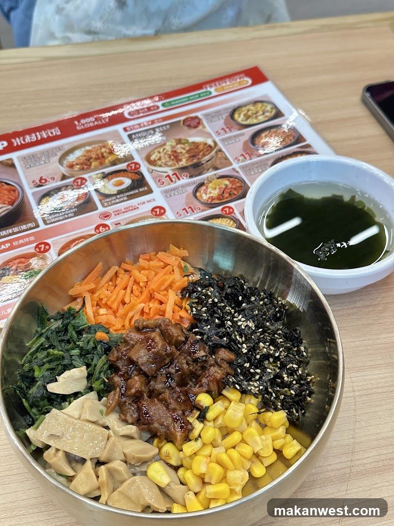 Bowl of Korean-style rice with toppings and seaweed soup