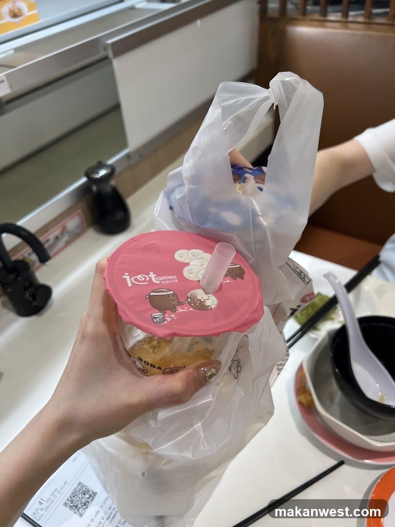 Boba drink in a plastic bag at a restaurant table