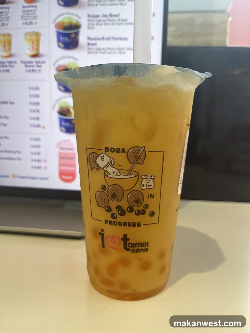 Boba Tea Cup with Menu in Background