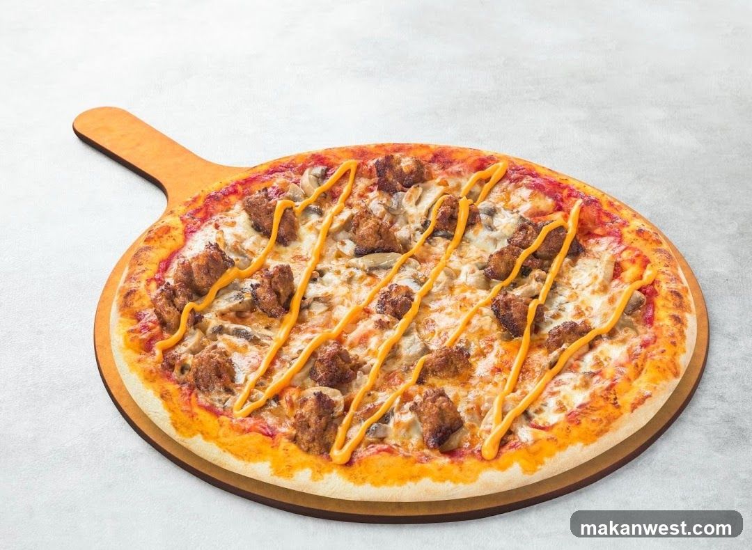 Pizza with sausage and sauce drizzle