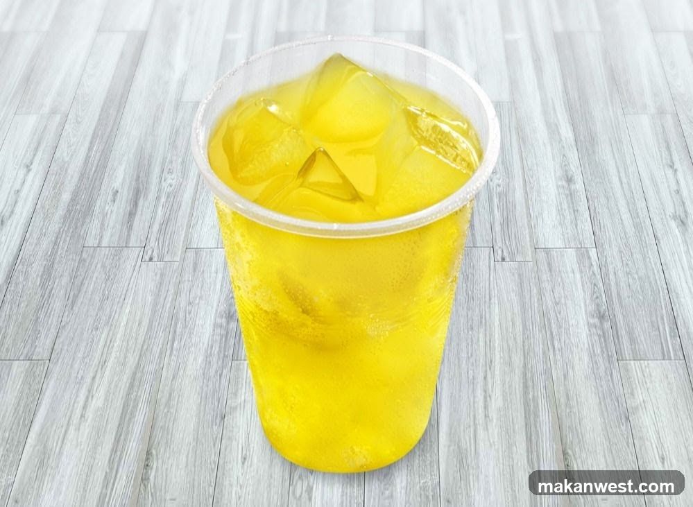 Yellow Iced Drink in Plastic Cup