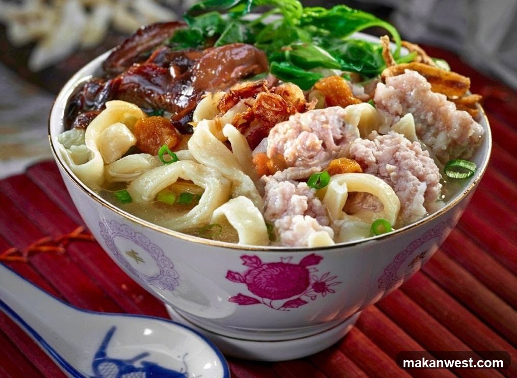 Bowl of Noodle Soup with Meatballs and Vegetables