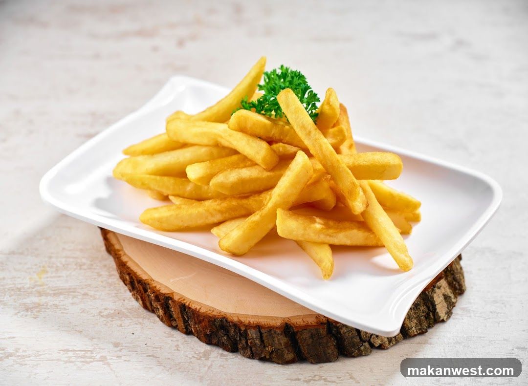 French Fries on a Wooden Slice
