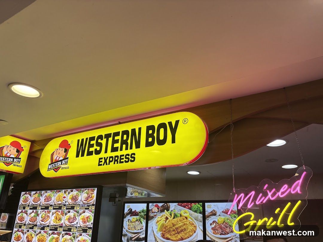 A brightly lit storefront featuring a large yellow sign with 'WESTERN BOY EXPRESS' and a cartoon mascot logo. Below the sign, there are illuminated menu boards displaying various food items like fried chicken, fries, and grilled dishes. A neon sign reading 'Mixed Grill' hangs to the right.