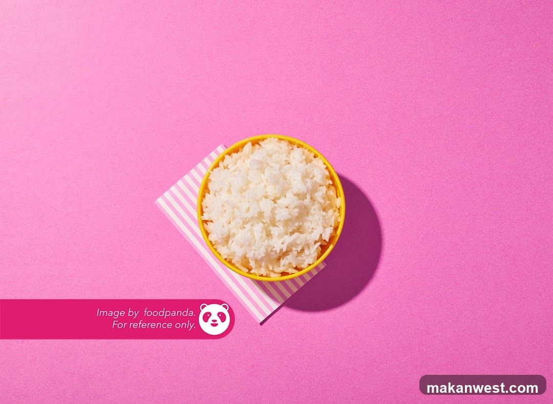 Bowl of White Rice on Pink Background