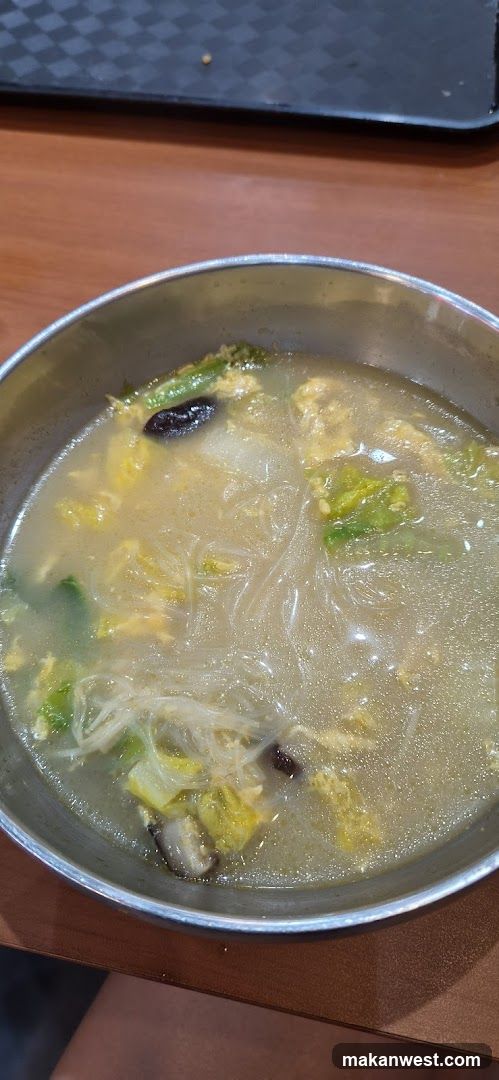 Bowl of Noodle Soup with Vegetables and Egg