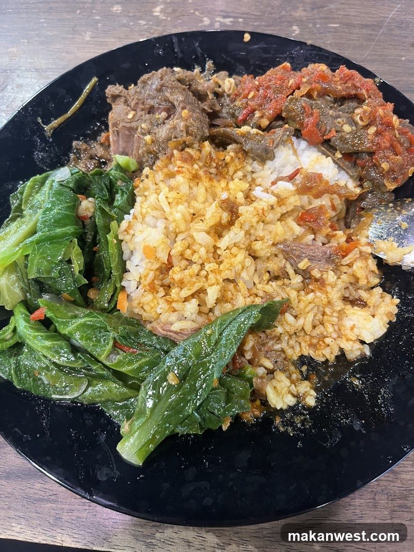 Plate of Fried Rice with Meat and Greens