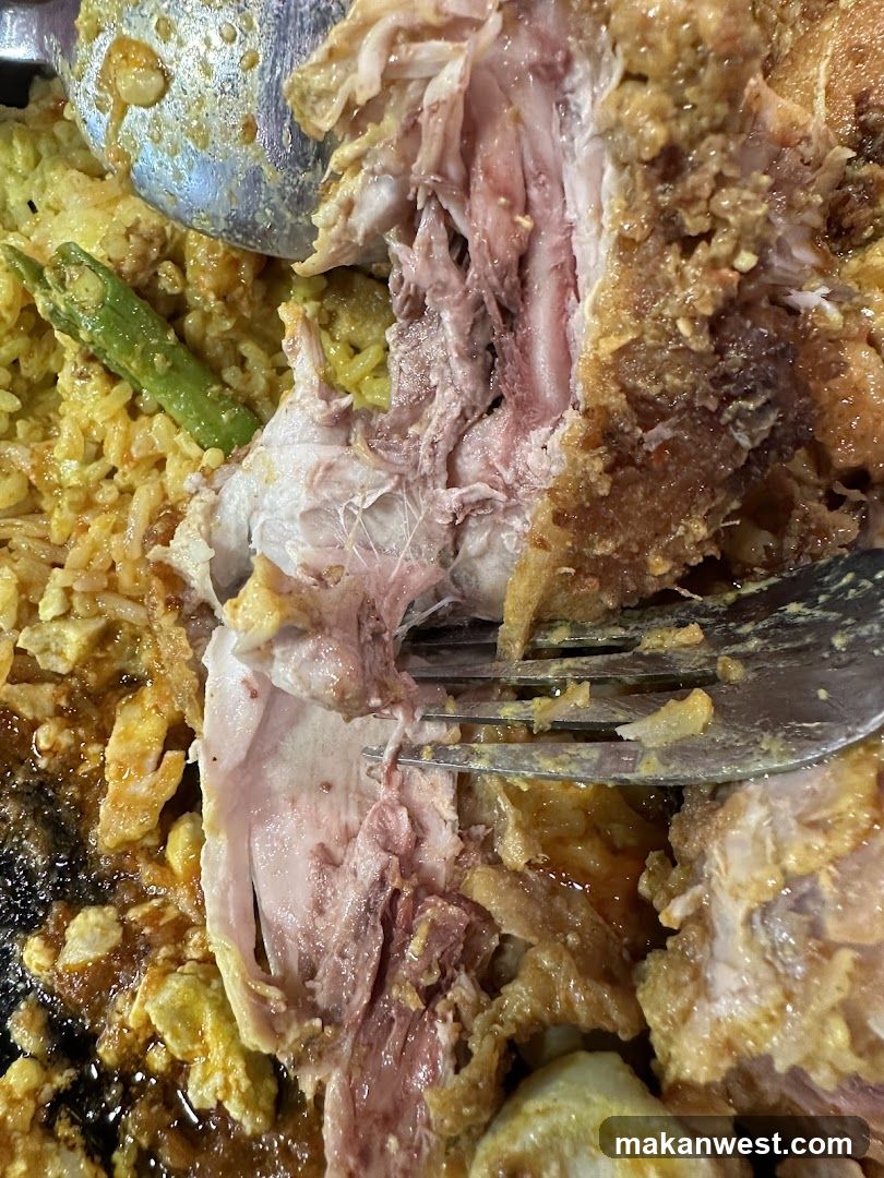 Close-up of Fried Chicken with Rice and Sauce