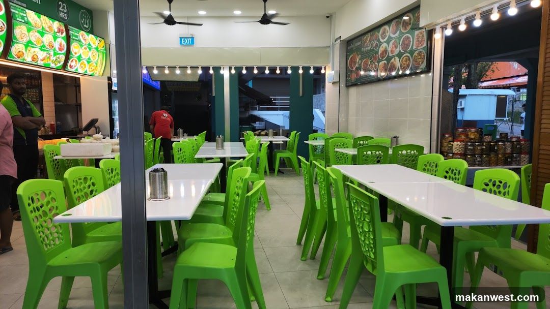 Restaurant Interior with Green Chairs and Menu Boards