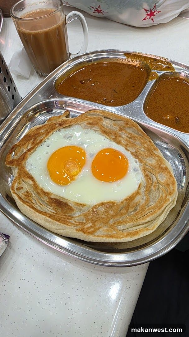 Breakfast Meal with Roti Canai and Curry