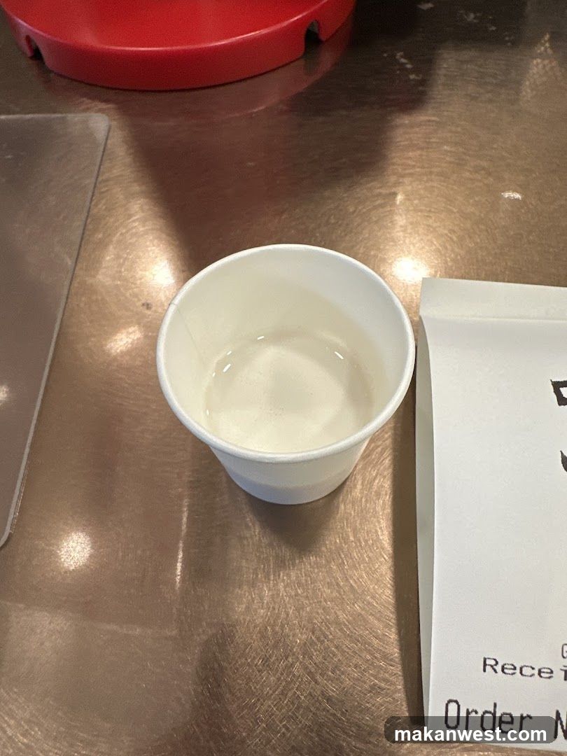 White Cup on Metal Table