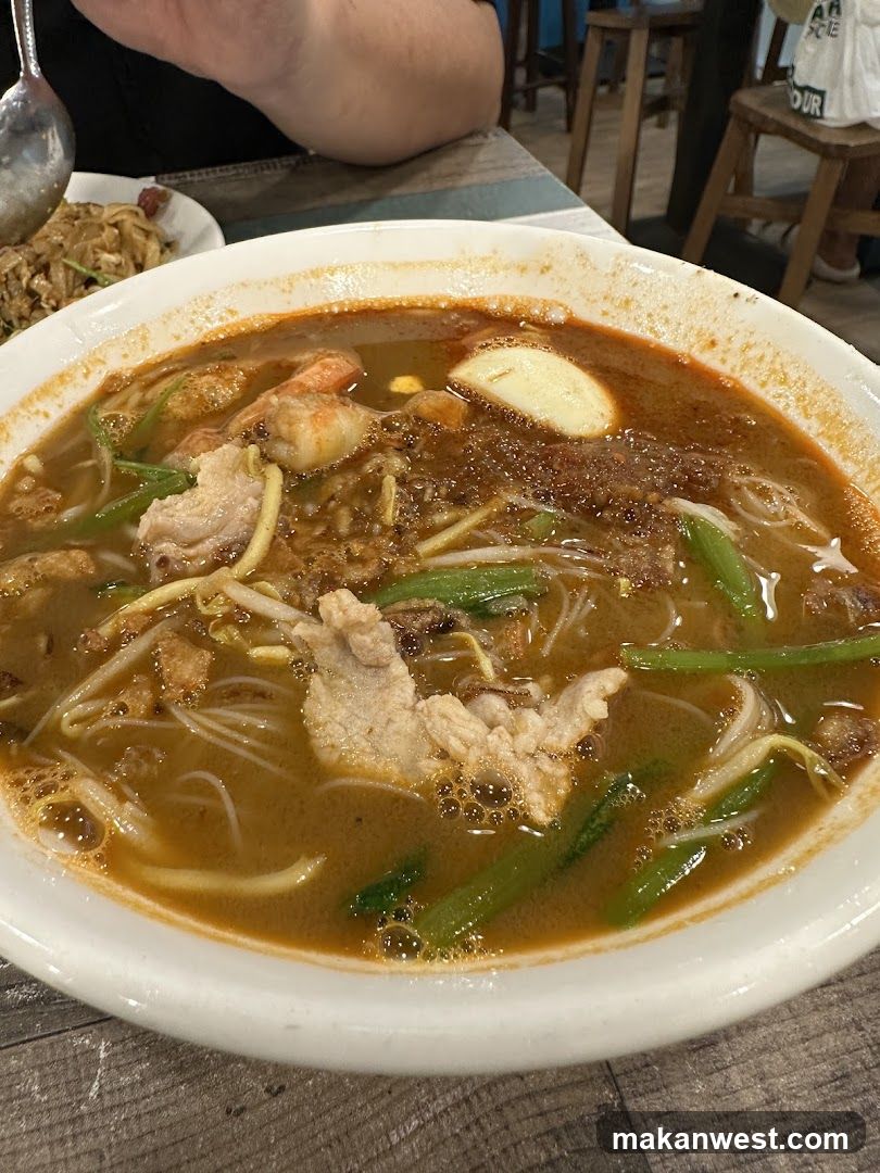 Bowl of Noodle Soup with Meat and Vegetables