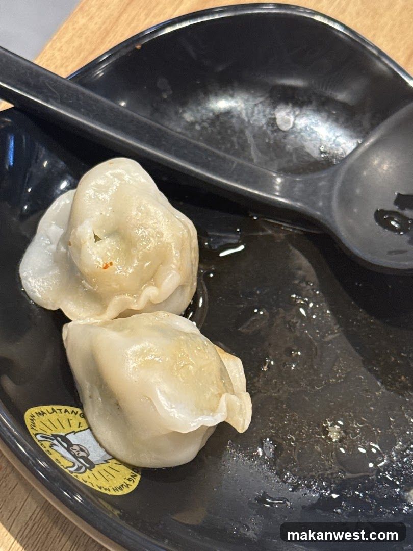 Dumplings on a black plate