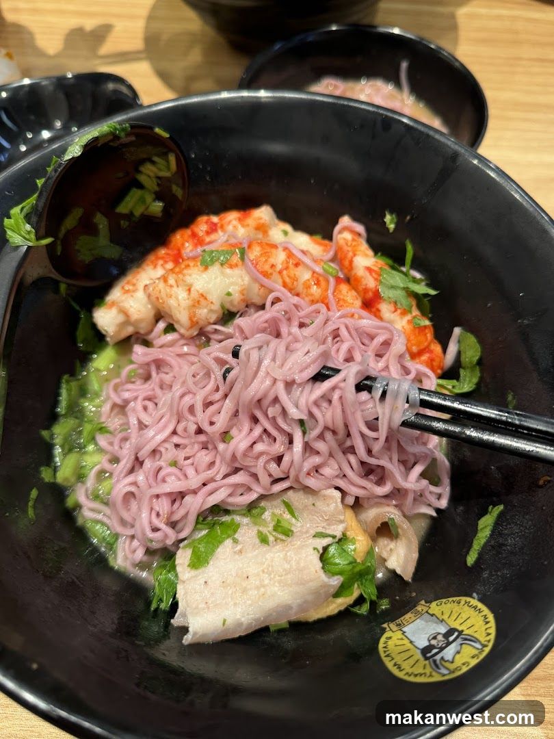 Bowl of Pink Noodles with Crab and Fish