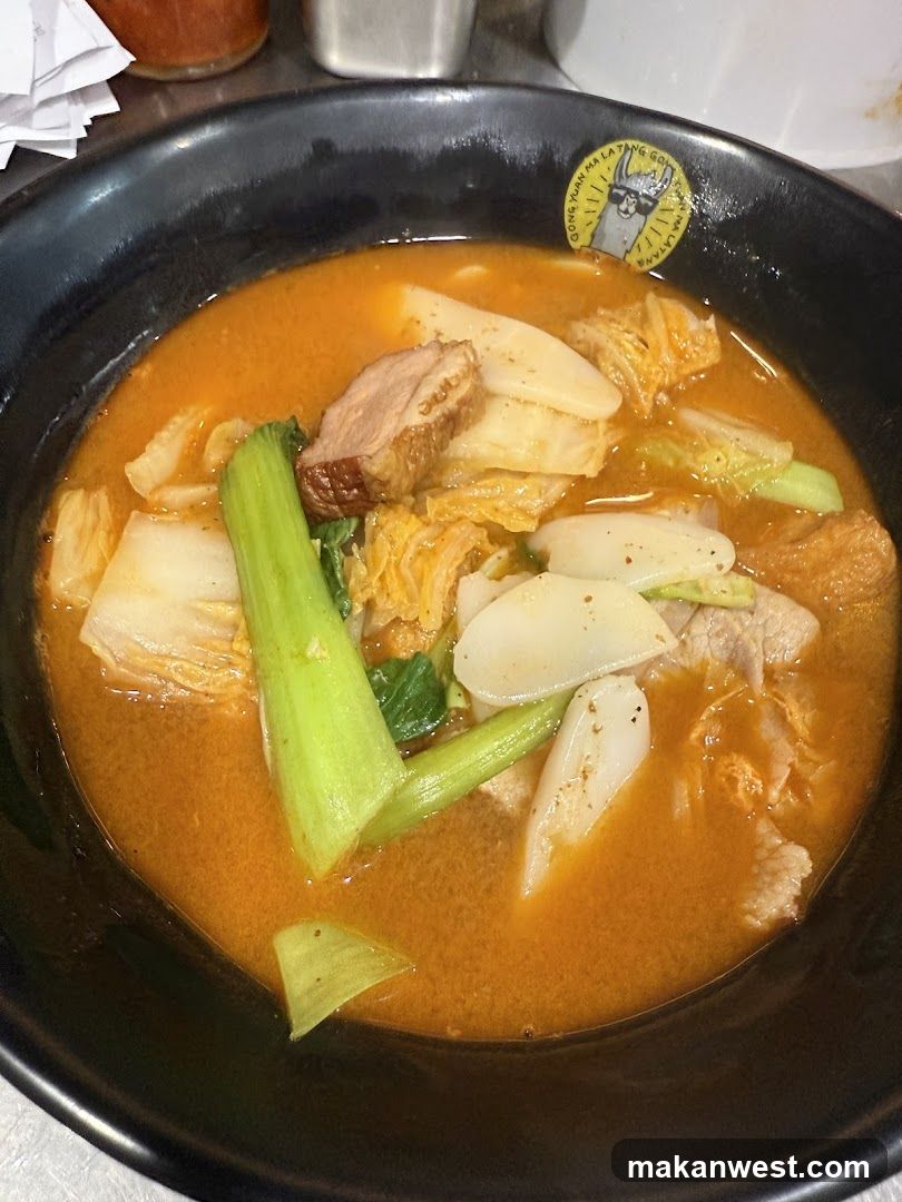 Bowl of Korean-style soup with vegetables and meat