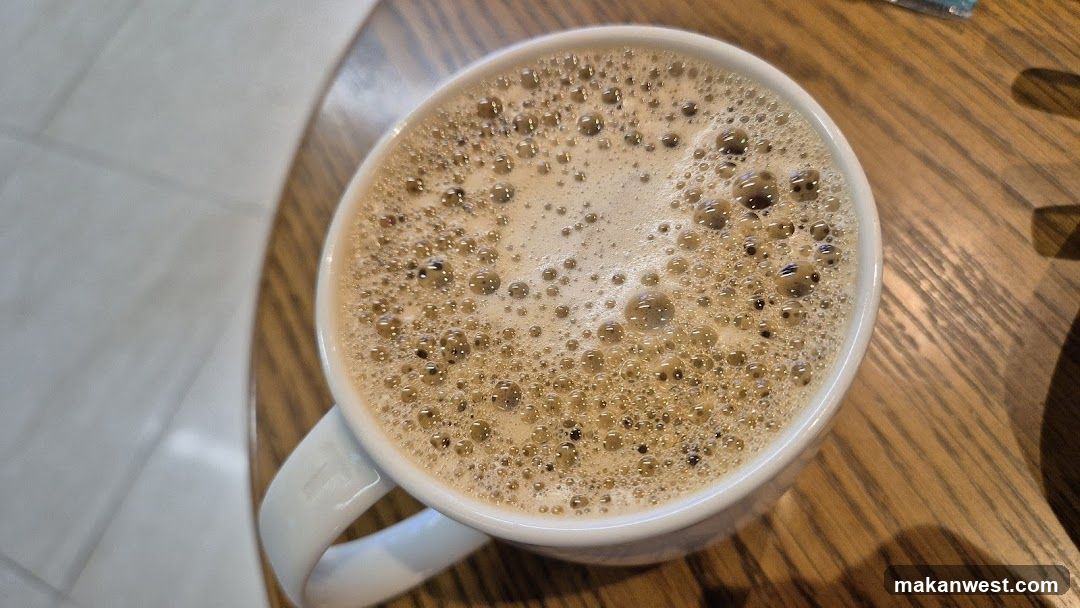 Foamy Coffee in White Mug