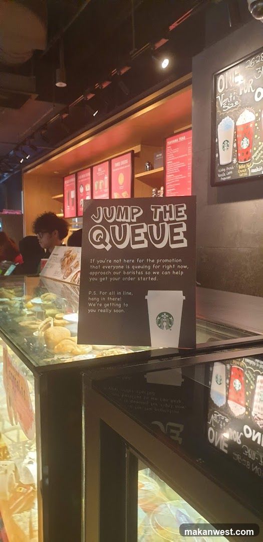 Starbucks Interior with Queue Sign
