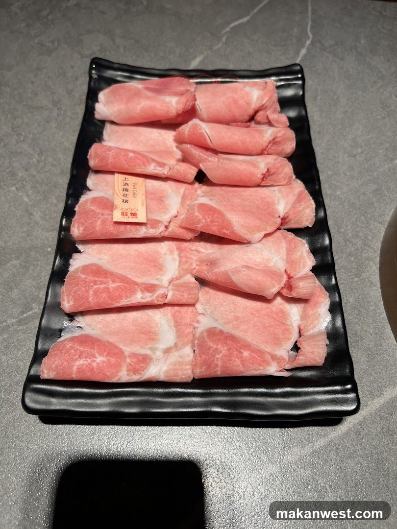 Sliced Pork on Black Plate