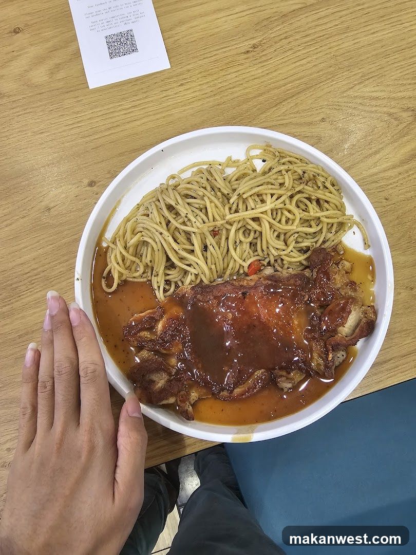 Plate of noodles with meat on wooden table