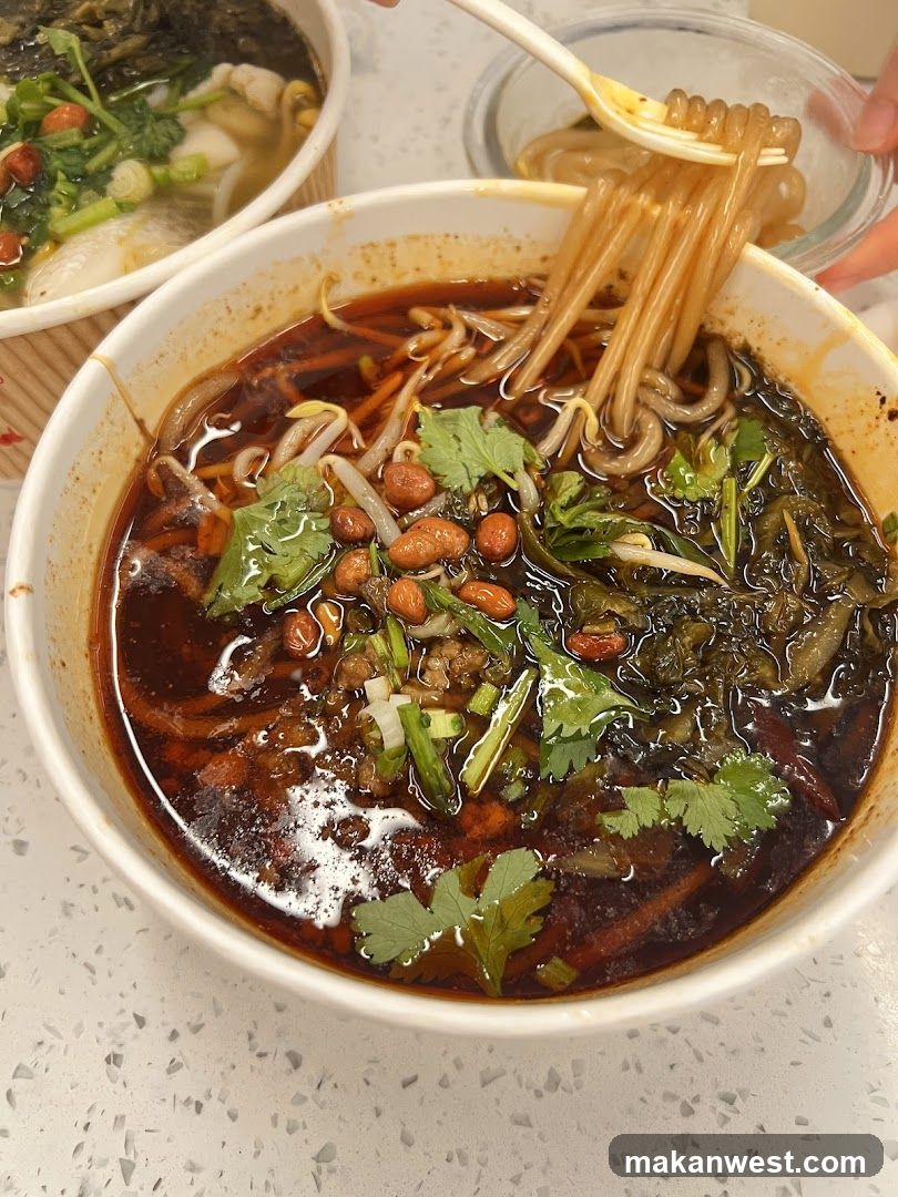 Spicy Noodle Bowl with Pickled Vegetables and Peanuts