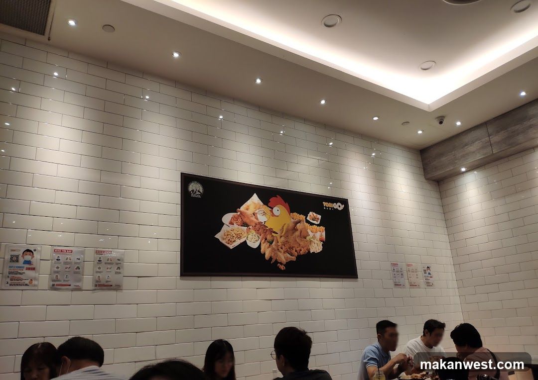 Restaurant Interior with White Tile Wall and Food Poster