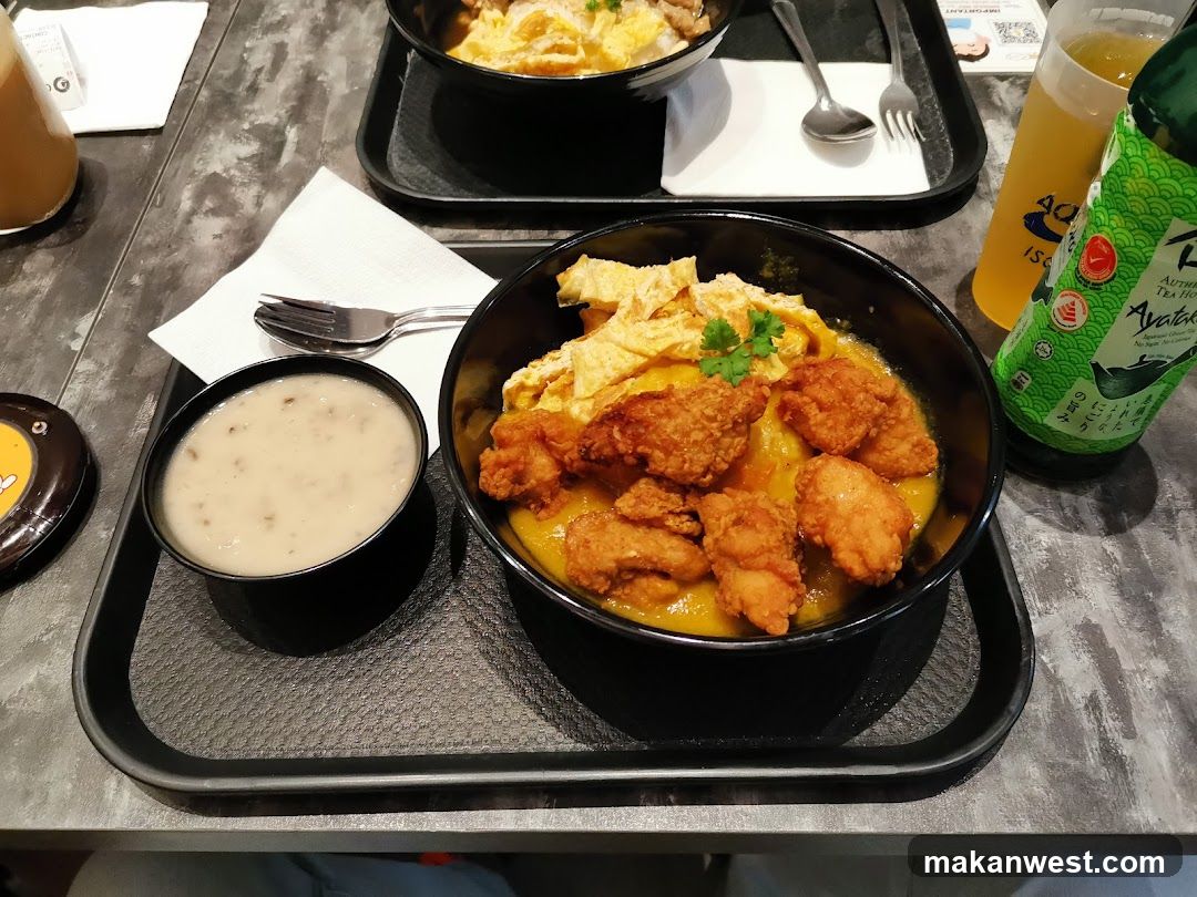 Bowl of Fried Chicken with Curry and Side Dish