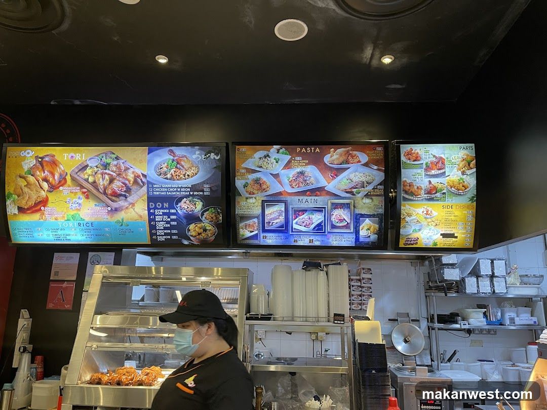 Restaurant Interior with Menu Boards and Staff