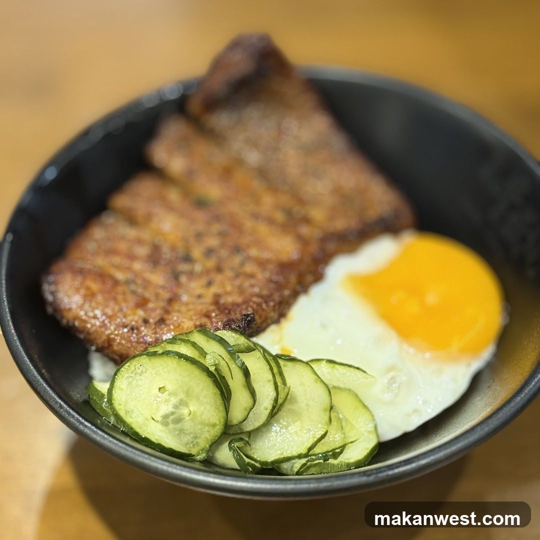 Bowl with Fried Egg and Cucumber Slices