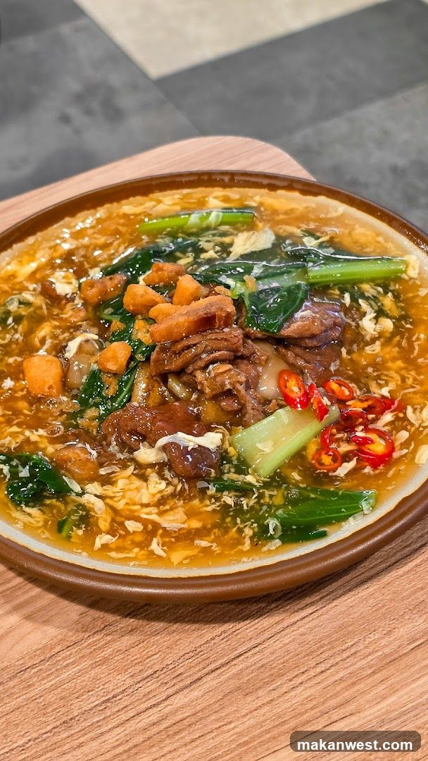 Bowl of Noodle Soup with Vegetables and Meat