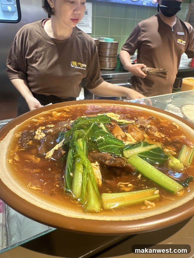 Bowl of Soup with Vegetables and Meat