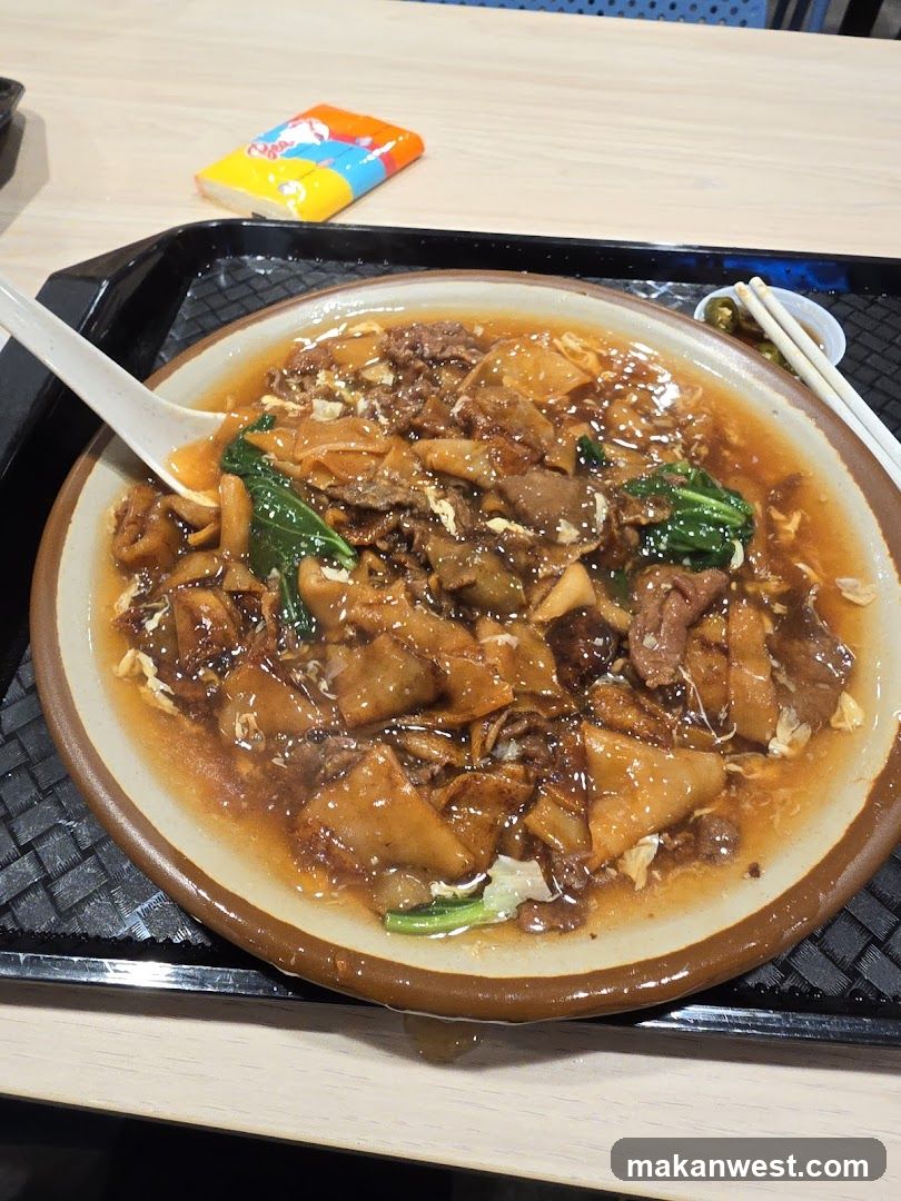 Bowl of Stir-fried Noodles with Meat and Vegetables