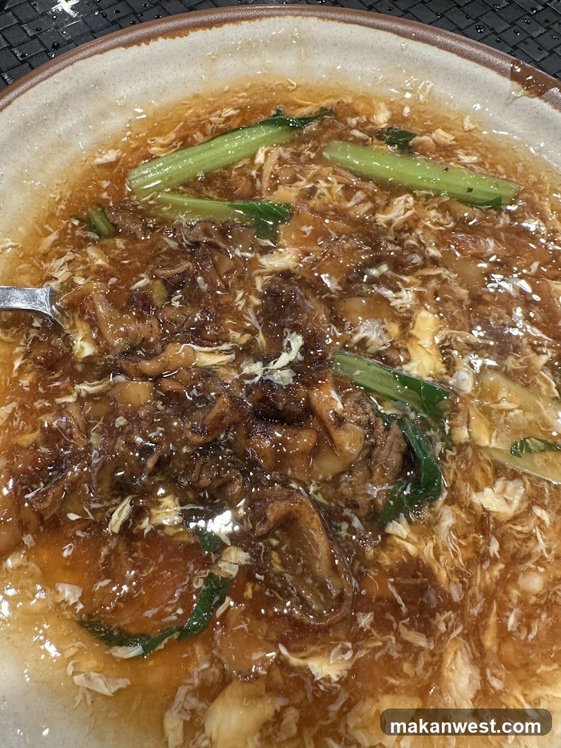 Bowl of Egg Drop Soup with Meat and Vegetables