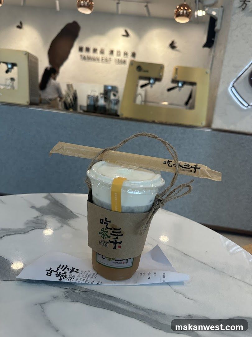 Drink with straw and receipt on marble table